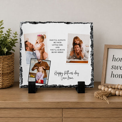 A black and white photo frame displaying a collage of three photographs, along with a message that reads "Happy fathers day love from". The frame is placed on a wooden surface, with a potted plant and a beaded decoration to the side.