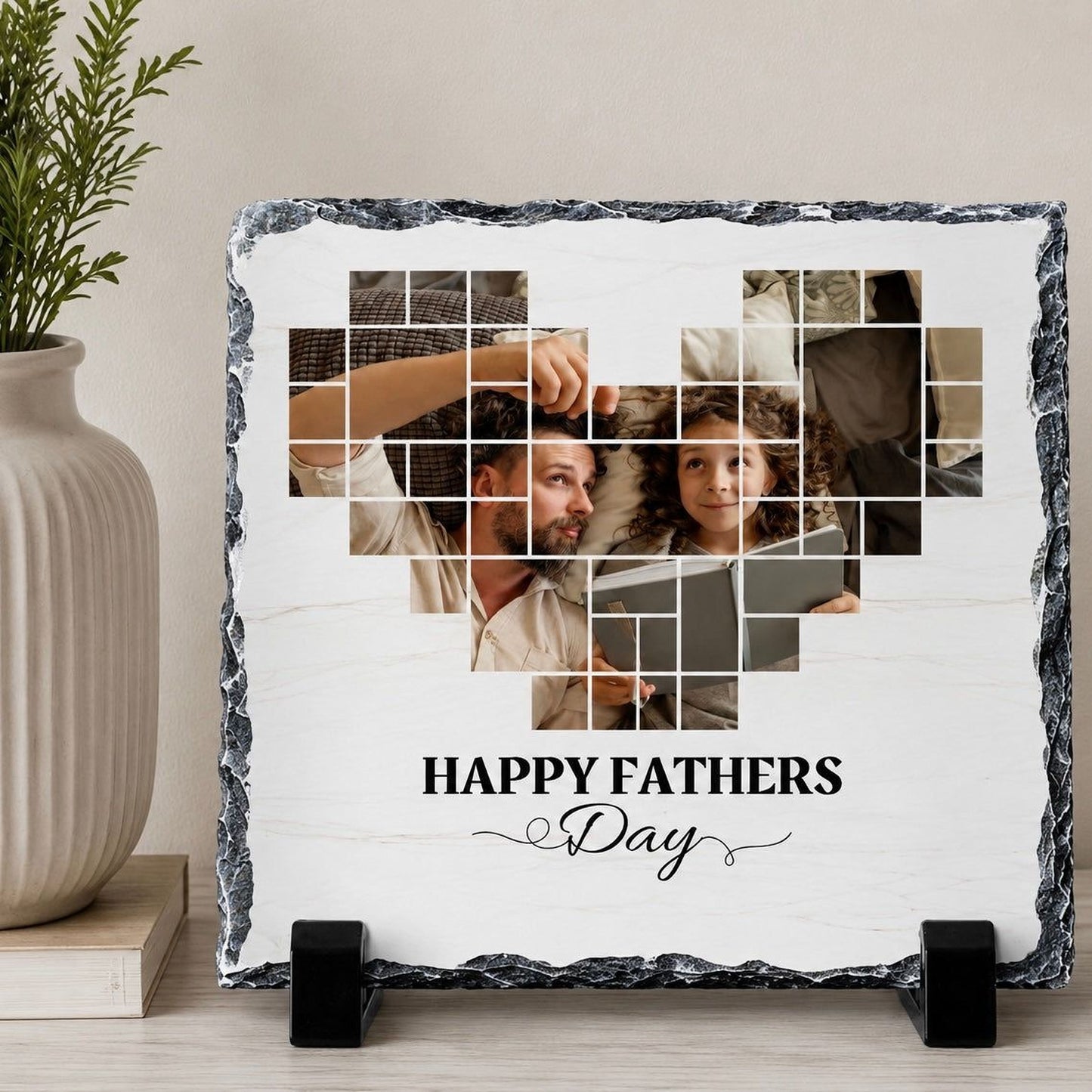 A heart-shaped photo collage on a slate, with the text "Happy Fathers Day" displayed below it.